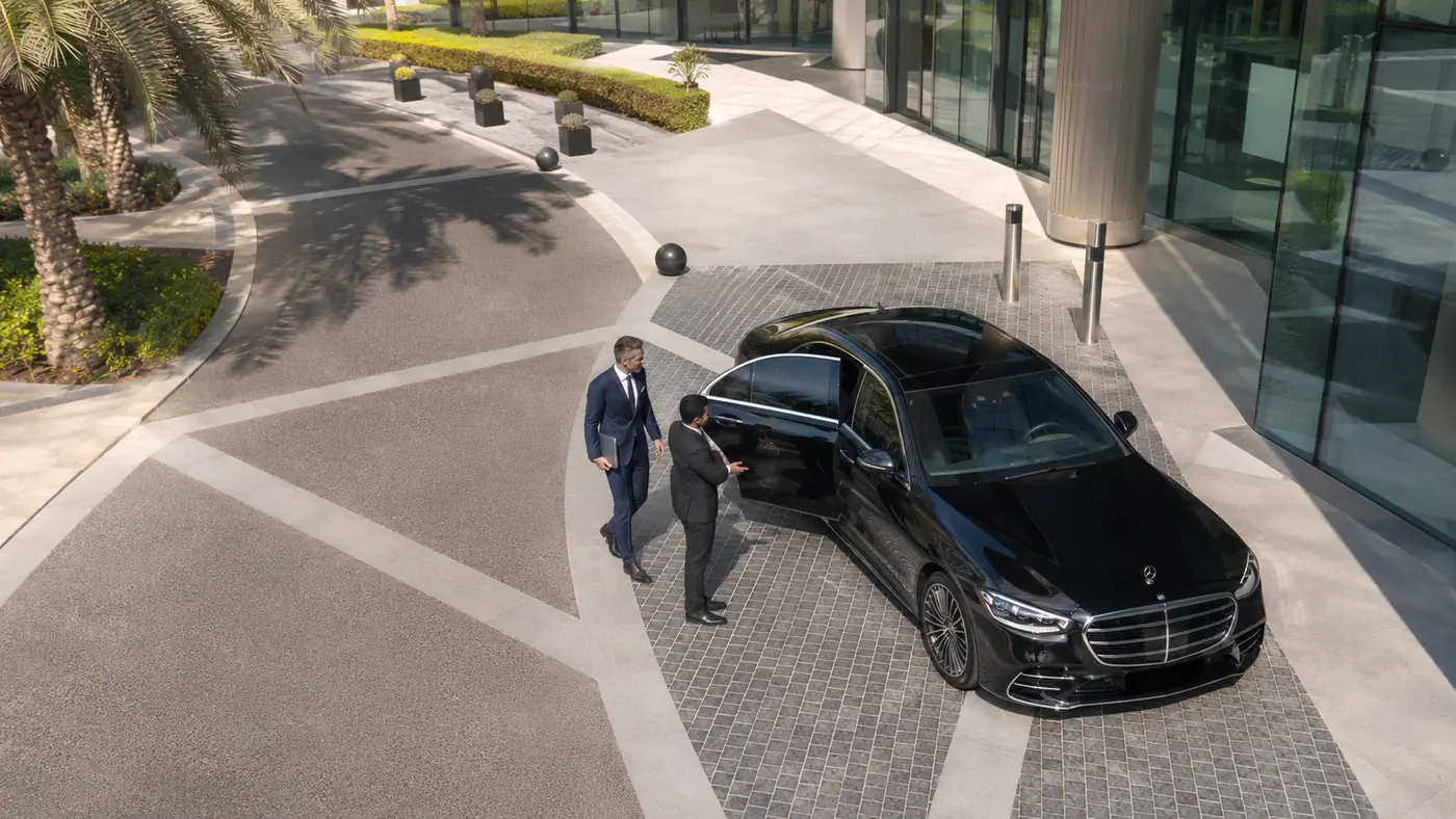 Aerial view of a Mercedes S-Class with chauffeur for business travel in Dubai